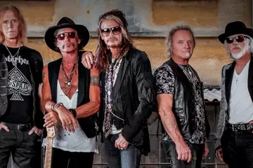 Kramer (second from right) with Aerosmith. Pic via Facebook