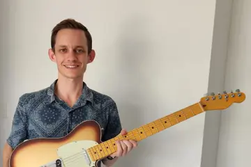 Corey Legge and his Fender guitar