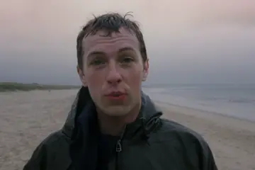 Deep-faked Chris Martin in the 'Grace' music video