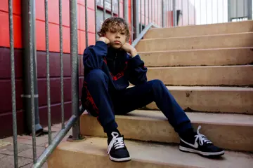 Inkabee sitting on stairs