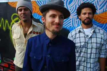 John Butler Trio. Nicky Bomba on the left of shot.