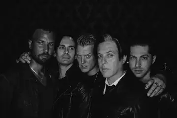Queens Of The Stone Age's Jon Theodore (left) + Michael Shuman (right)