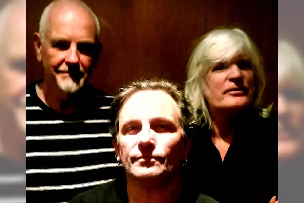 X (Steve Lucas, Kim Volkman & Doug Falconer)