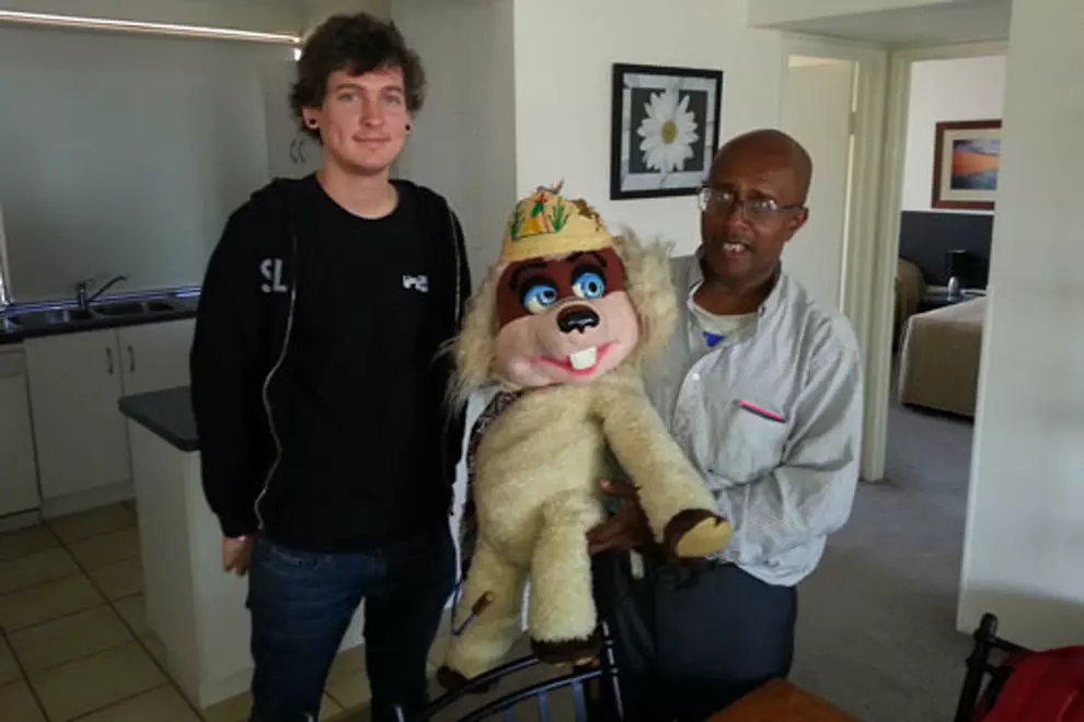 Two men and a puppet.