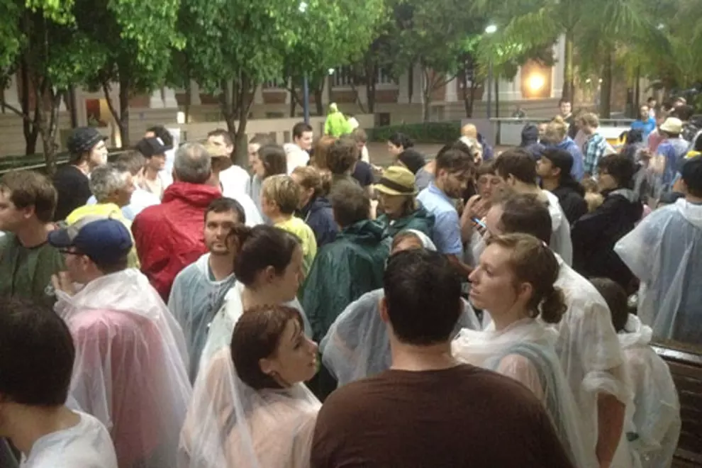 Punters taking shelter at QUT. Pic by Stephen Booth