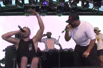 Dylan Alcott raps on-stage at Meredith