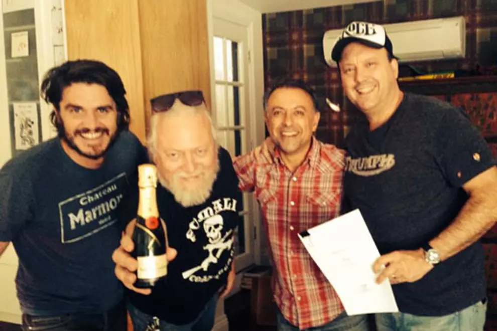 'Lazy' Pete Lewis, Jon Perring, Andy Portokallis and James Young confirming the deal