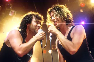 Jimmy Barnes and Michael Hutchence. Pic via DeciderTV