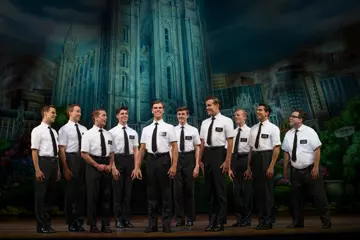 Blake Bowden, Nyk Bielak and company of 'The Book Of Mormon'. Pic by Jeff Busby