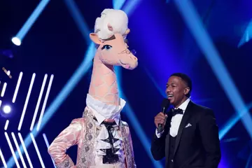 Host Nick Cannon with one of this year's contestants