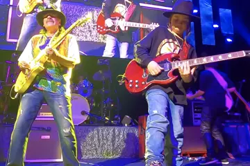 Taj Farrant on stage with Santana. Pic via YouTube