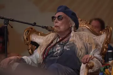 Joni Mitchell on stage in Newport