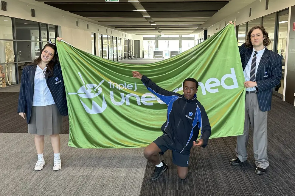 LEE and friends with the Unearthed High banner