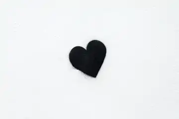 Photo of a black heart on a white background