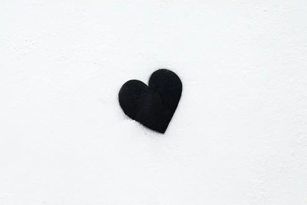 Photo of a black heart on a white background