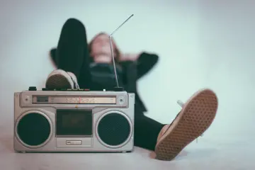 Woman laying with a radio