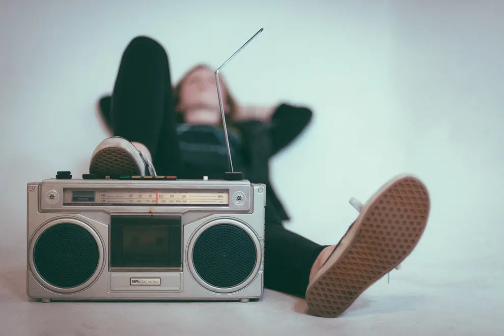 Woman laying with a radio