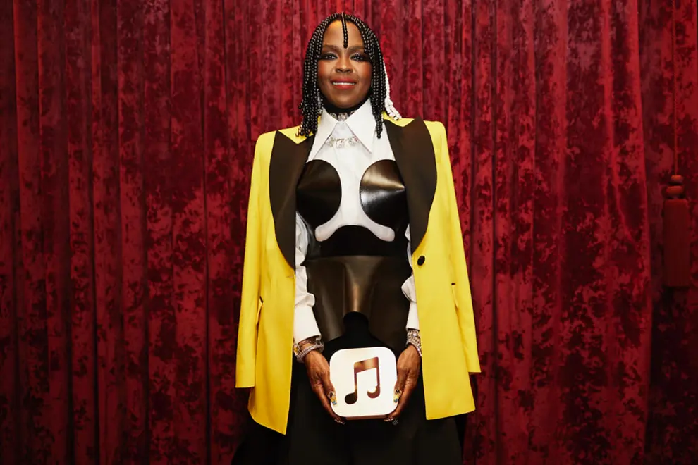 Lauryn Hill holding her Apple Music #1 album award