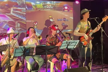Mario Kart Live! You play the game; they play the music. 