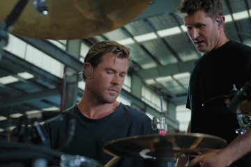 Ben Gordon teaching Chris Hemsworth how to play the drums