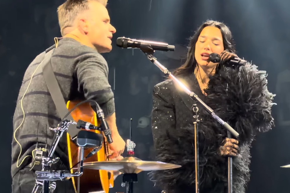 Dua Lipa performing with Ben Gibbard