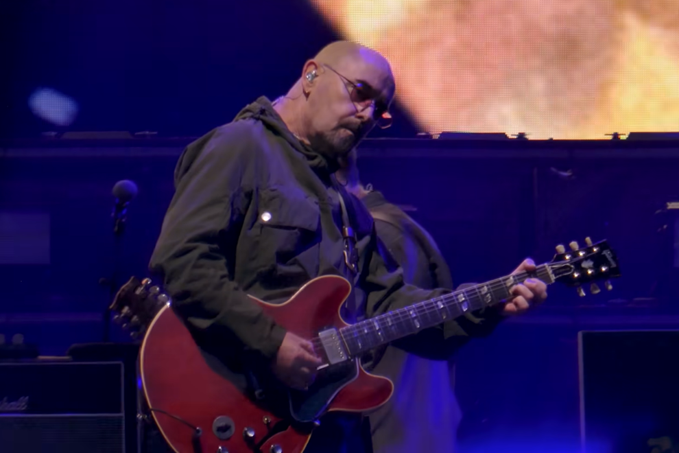 Paul "Bonehead" Arthurs performing with Oasis