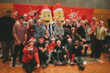 Triple j - pictured here celebrating their Christmas single with friends - finish the year on a high